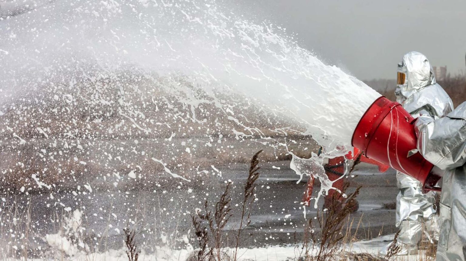 hazmat workers throwing foam